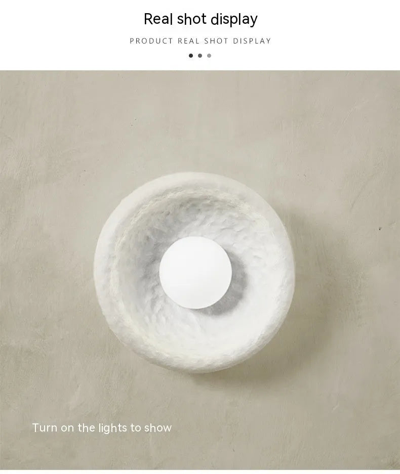 Japanese-style simple silent wall lamp with resin shade in warm white light.
