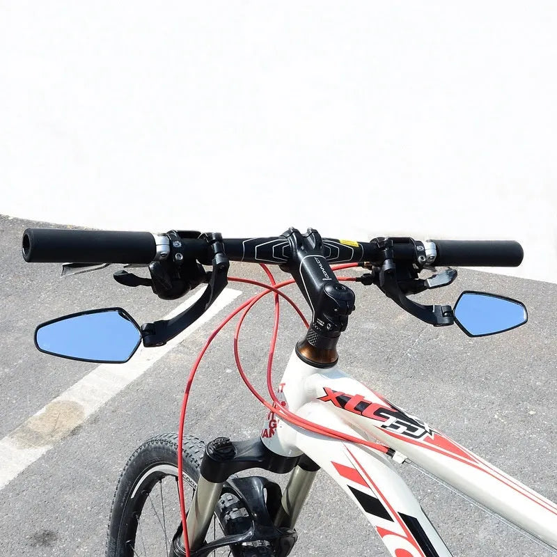 Black bicycle rearview mirror with wide 210mm acrylic lens mounted on a handlebar.