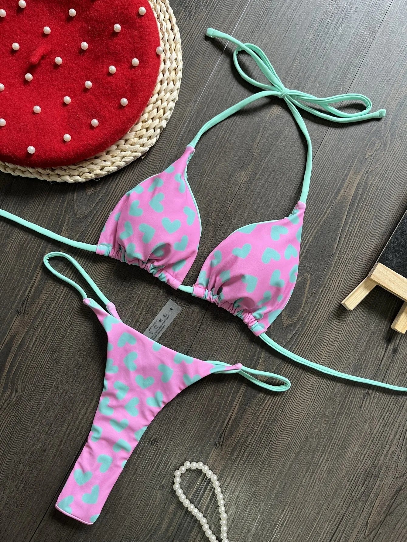 Heart printing backless split swimsuit in nylon fabric with cotton lining, available in sizes S, M, L