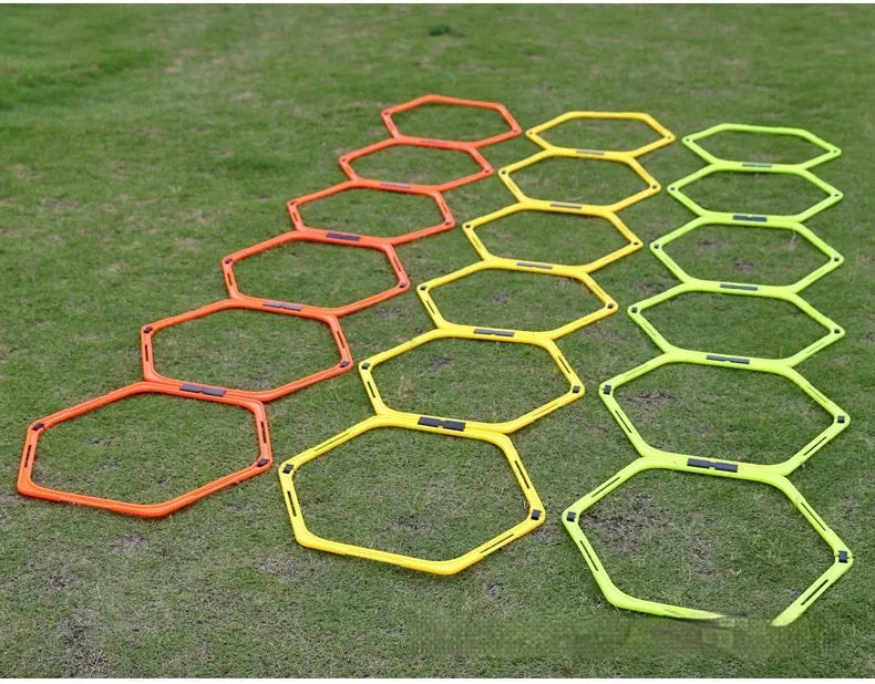 Six foldable hexagon agility training rings in yellow, green and orange colours for football drills