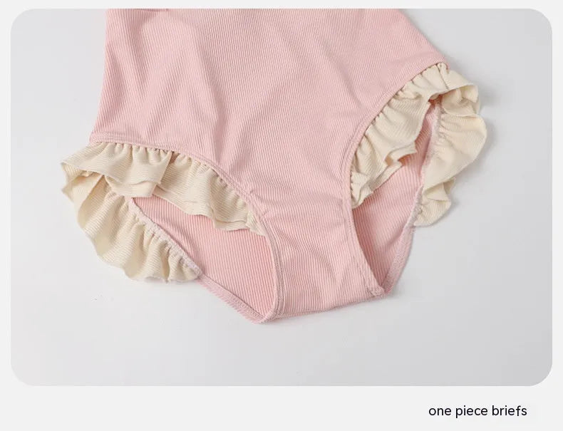Pink women's one-piece swimsuit with conservative Siamese style design