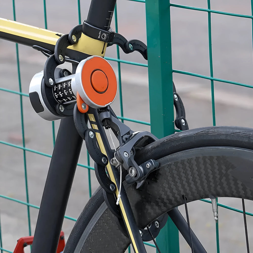 Portable black and black orange bicycle folding lock with multi-material construction.