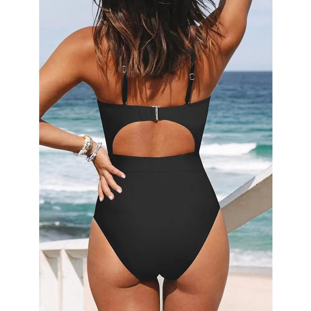 Women's solid colour backless one-piece swimsuit on a hanger, showing high elasticity fabric.