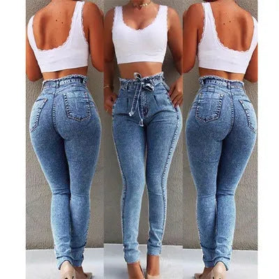 Pair of women's light blue straight-leg jeans with a frayed, distressed hem detail.