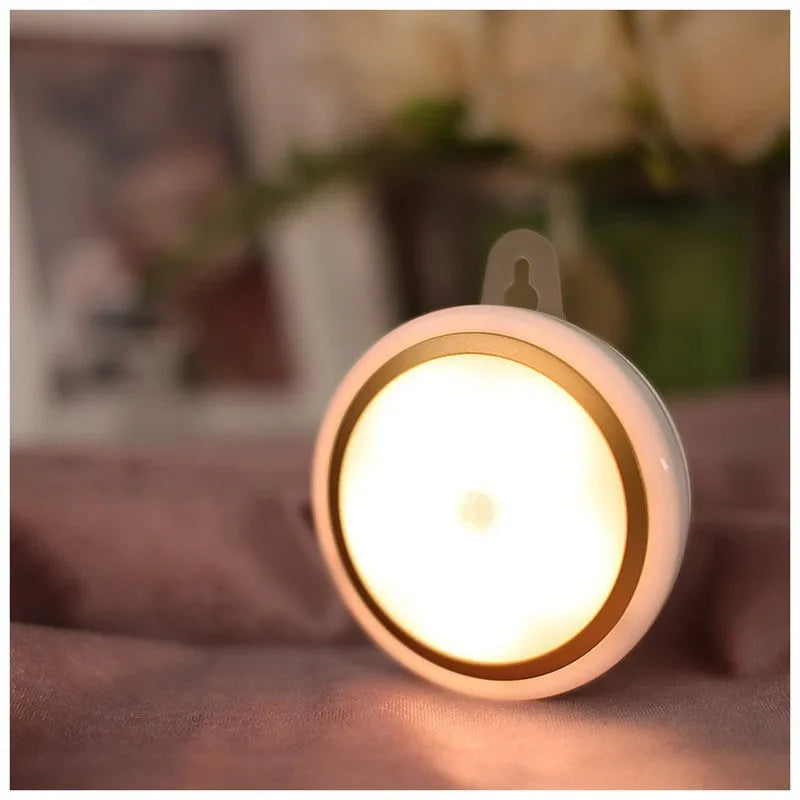 Circular motion sensor LED light unit showing front diffuser and compact 80mm diameter design