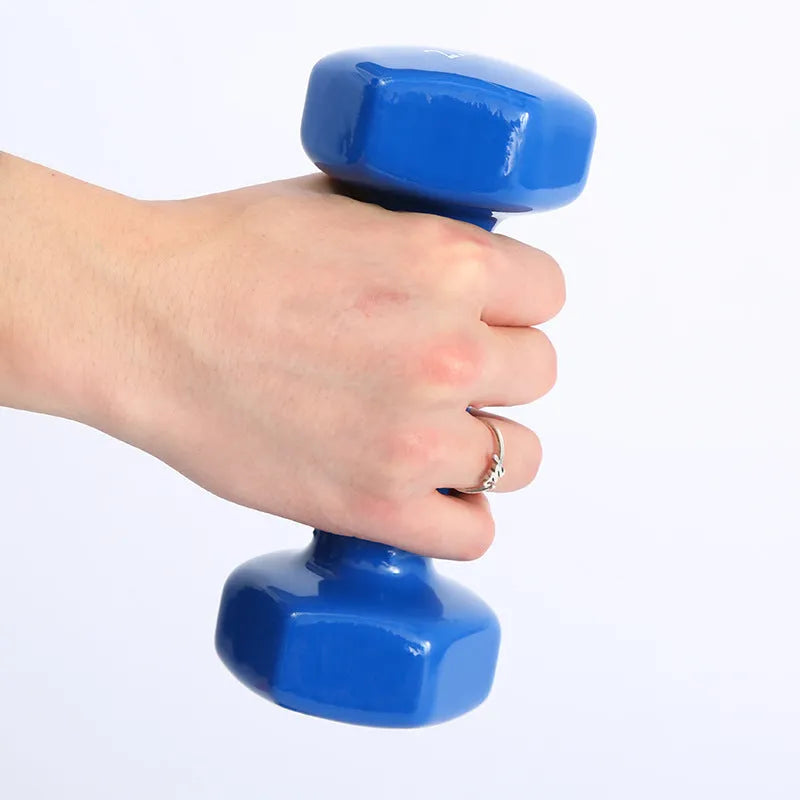 Colourful plastic-coated fitness dumbbells in bright colours for home workouts