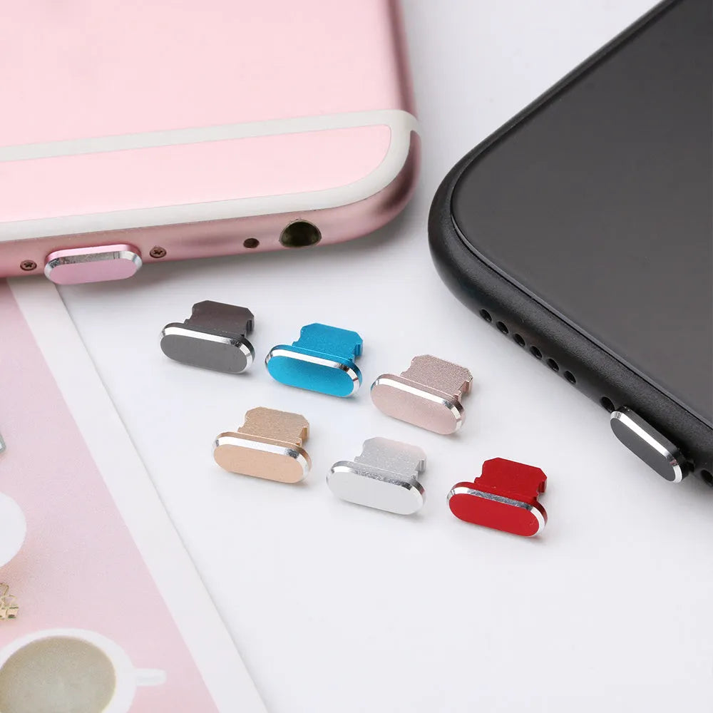 Aluminium alloy mobile phone charging port dust plug for iPhones, shown in rose gold colour.