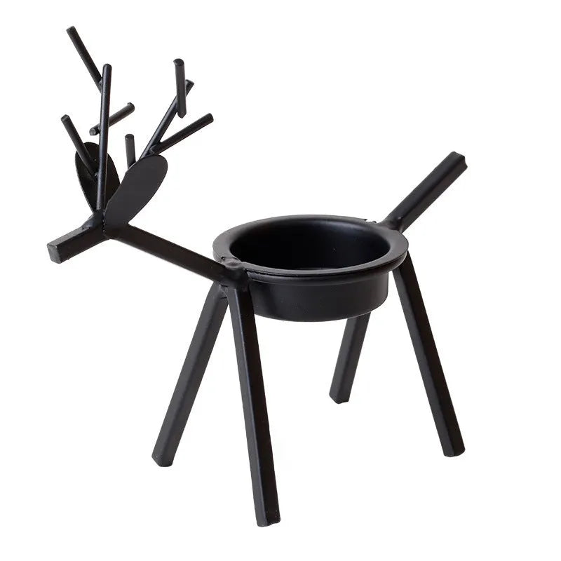 Black iron Christmas candlestick holder with detailed elk and deer design