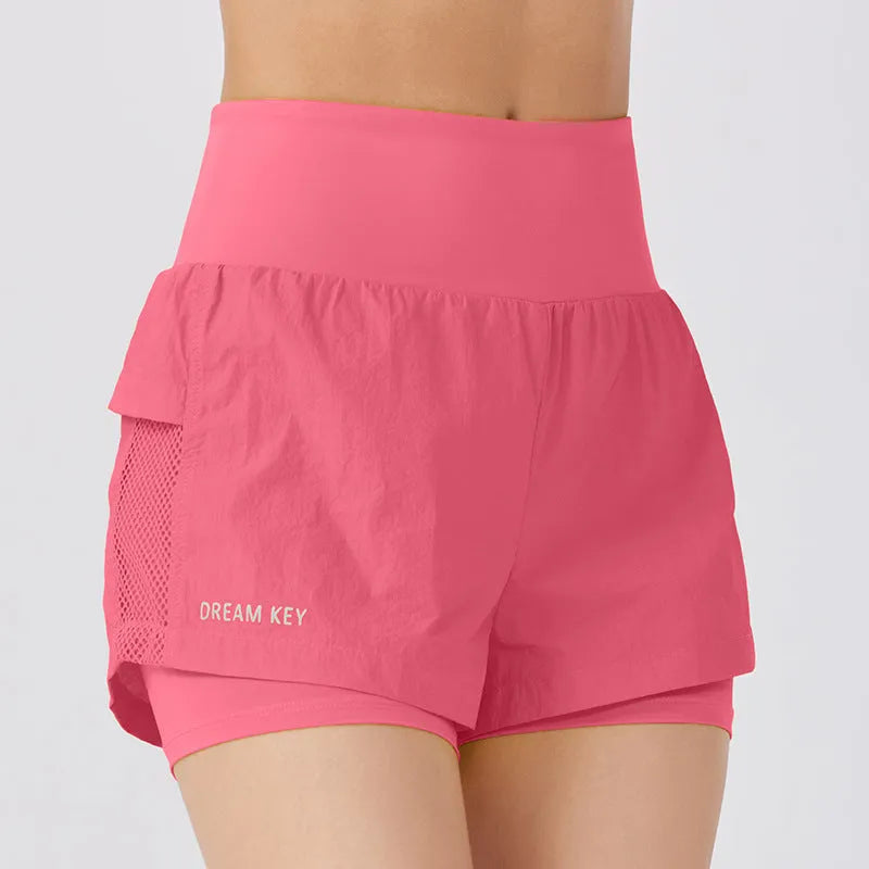 Women's loose casual quick-drying sports shorts in cotton blend fabric on a hanger.