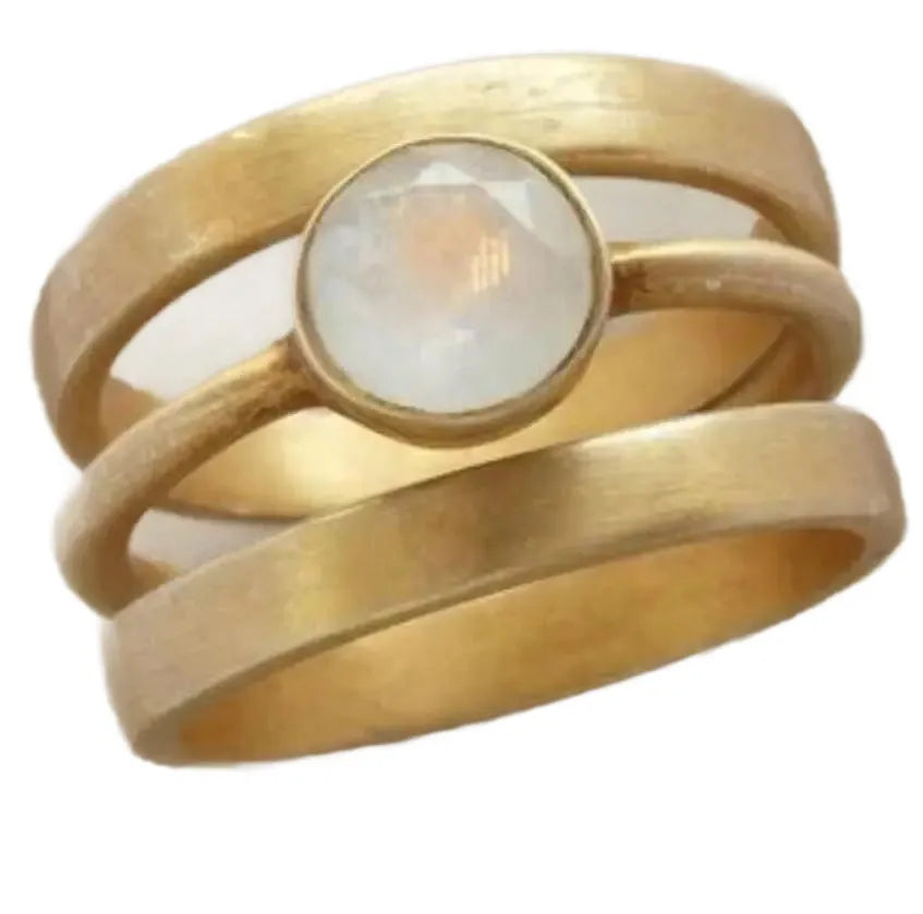 Gold geometric ring with hollow design and white chalcedony inlay on hand