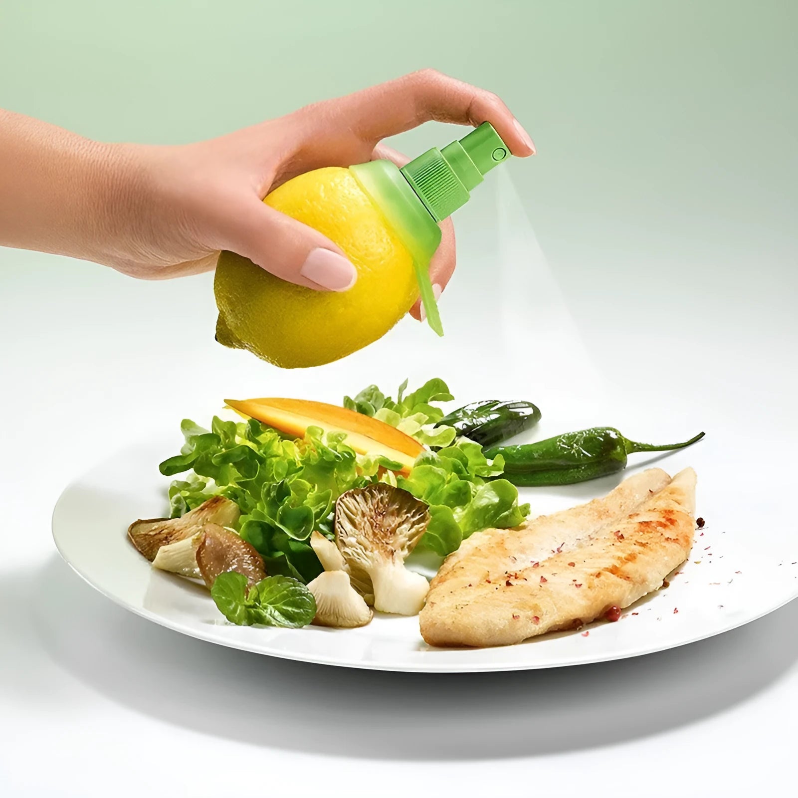 Green lemon sprayer with screw-in nozzle and PVC silicone ring for juice dispensing