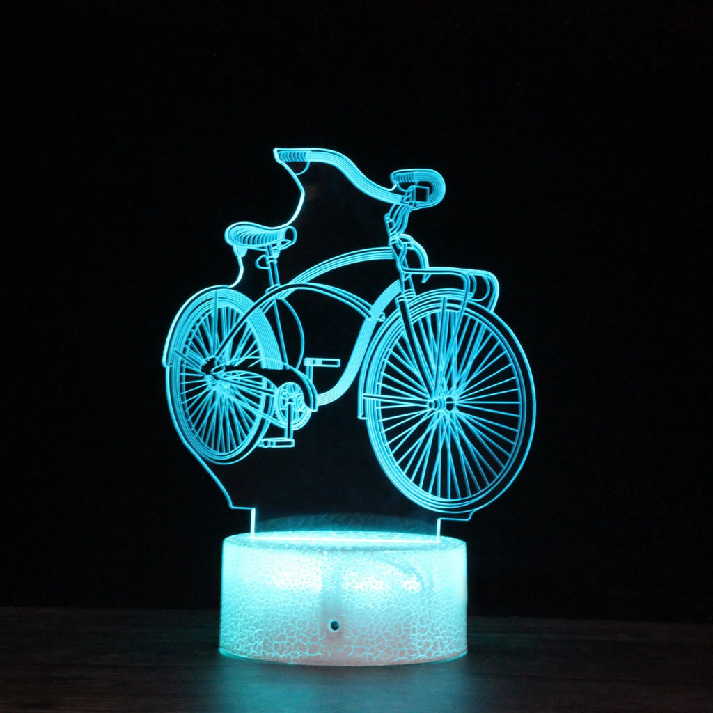 Bicycle series 3D night light with colourful LED glow on black base against dark background