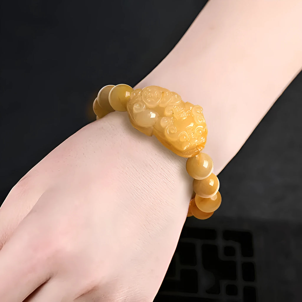 Carved Jinsi Jade money bracelet showing golden thread detail, displayed in large and small size options.