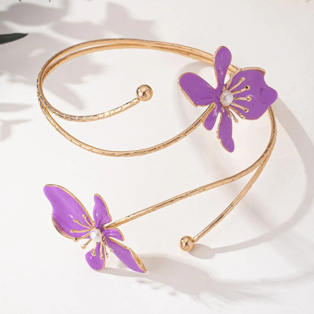 Pink alloy armband bracelet with hollow geometric linear pattern.