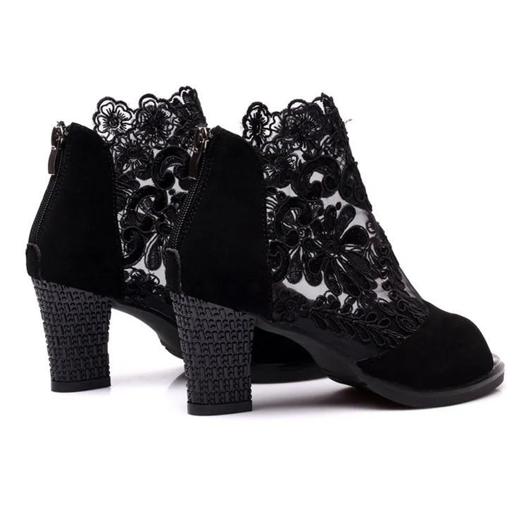 Women's black lace gladiator sandals with square heel and zip closure showing floral patterns