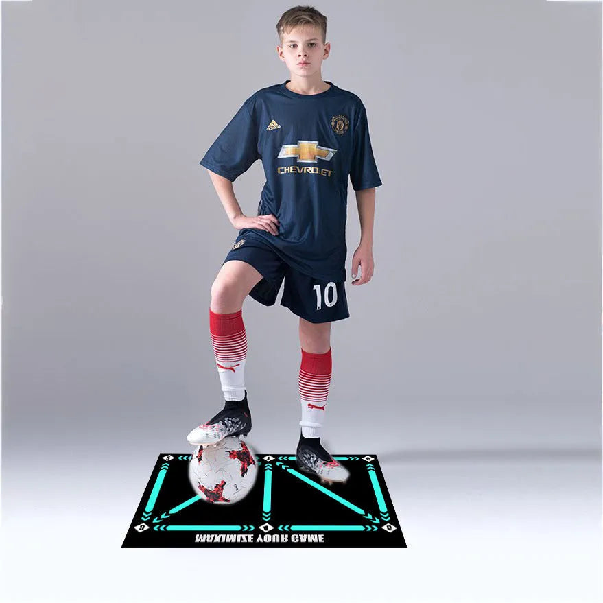 Black 60x90cm football training mat on a flat surface