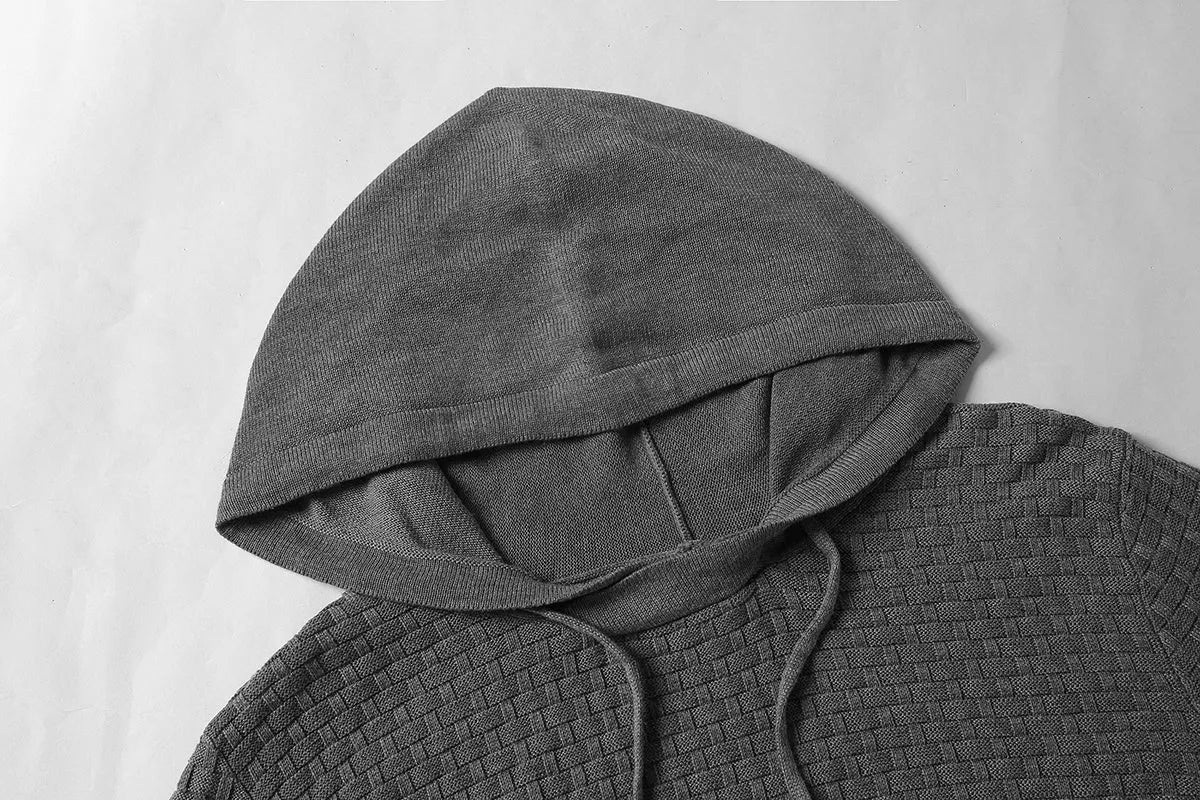 Men's black hoodie sweater made from cotton and polyester blend fabric.