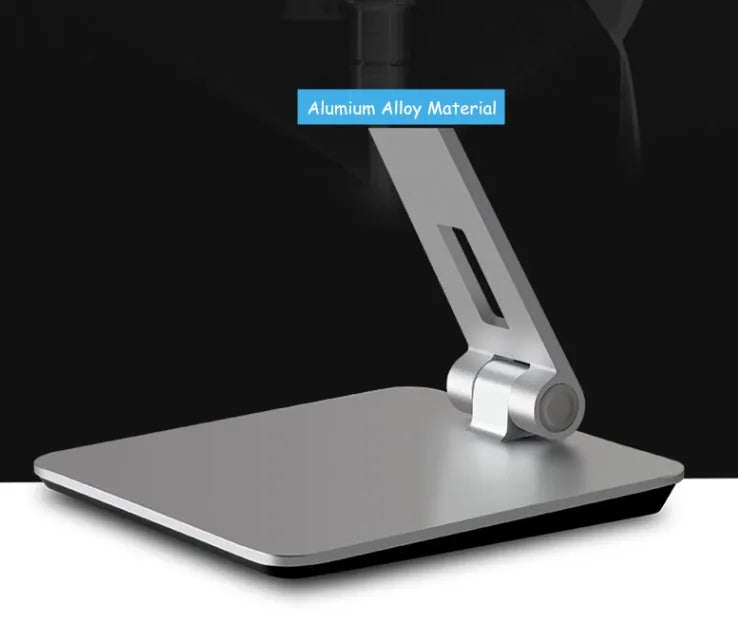 Folding aluminium phone and tablet stand on a desk, shown in silver colour with 360-degree rotation.