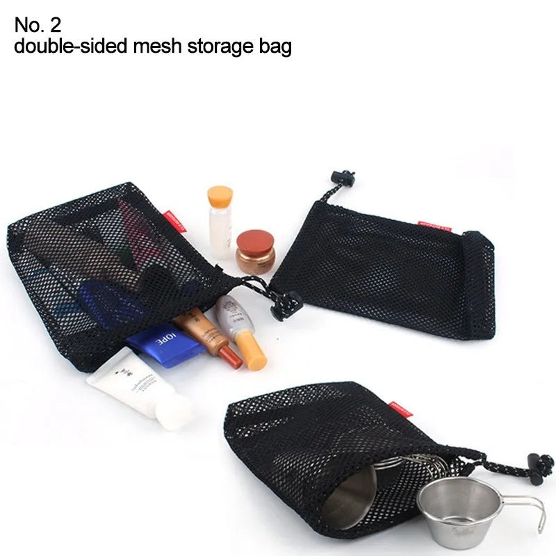 Set of five red outdoor travel storage bags with zippers and mesh panels.