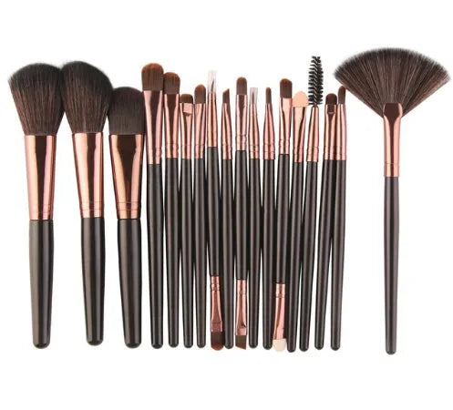 MAANGE 18 piece makeup brush set with fan-shaped cosmetic tools on a table.