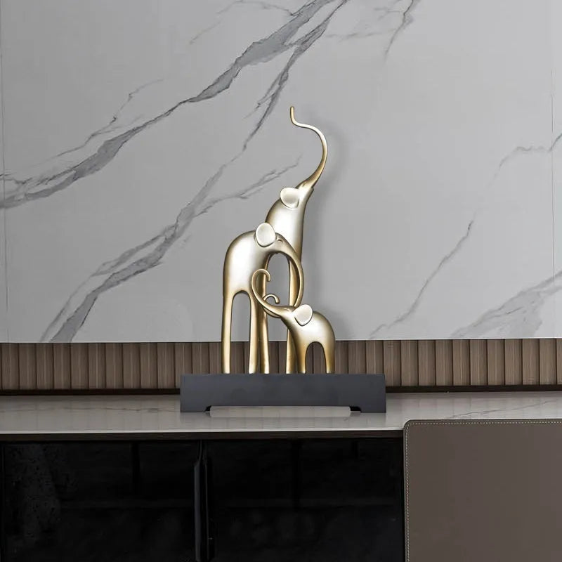 European style resin elephant decorative ornament in bright gold finish displayed on wooden surface