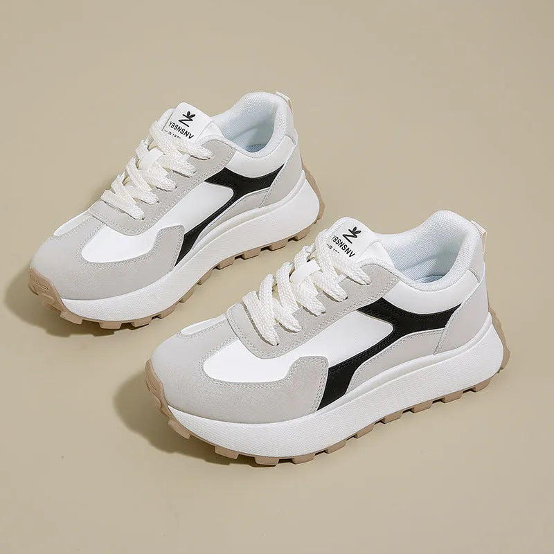 Women's low-top sports running shoes with mesh lining and front lace-up closure in solid colour options