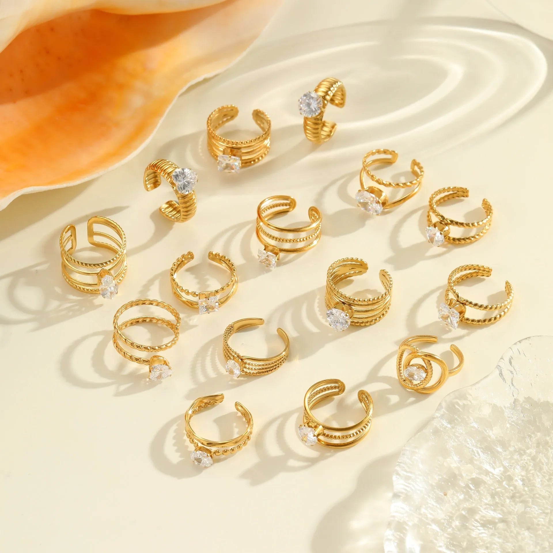 Gold electroplated stainless steel ring with zircon stones and open mouth adjustable design