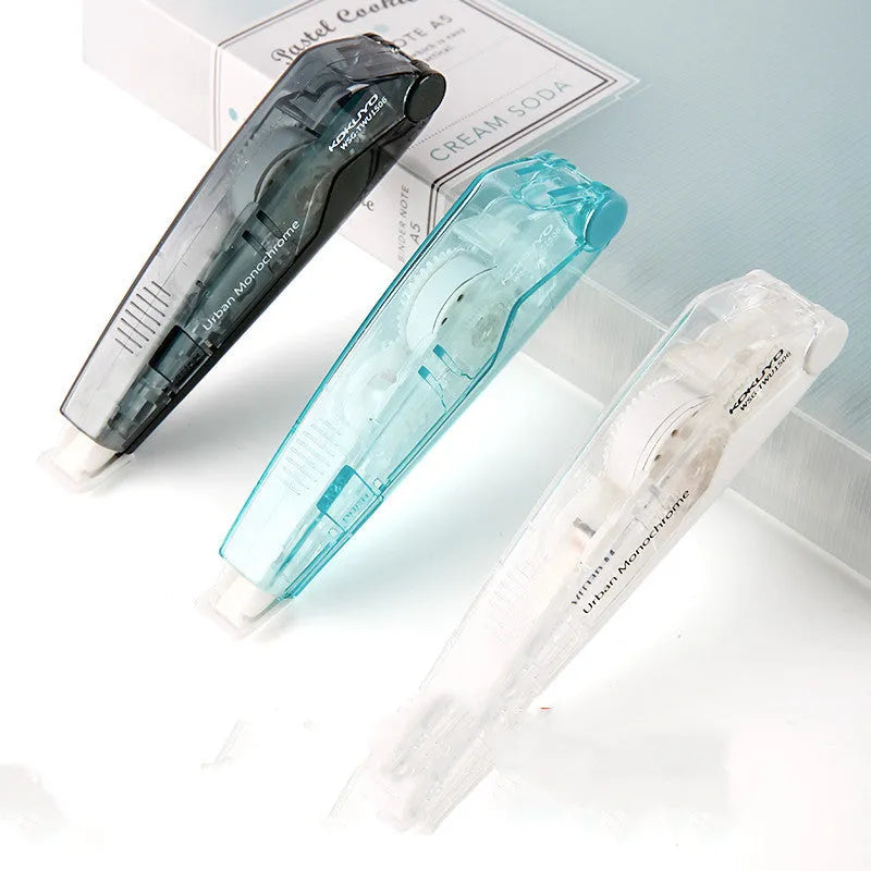 Refillable correction tape with transparent cartridge in black, white, blue, pink, or yellow colours