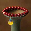 Handcrafted gold cinnabar wave bracelet with copper beads in national style design