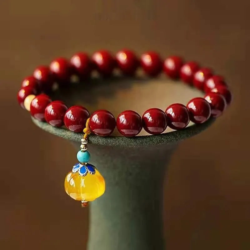 Handcrafted gold cinnabar wave bracelet with copper beads in national style design