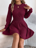 Women's long sleeve black sweater dress with lantern sleeves and a twist-design elasticated waist.