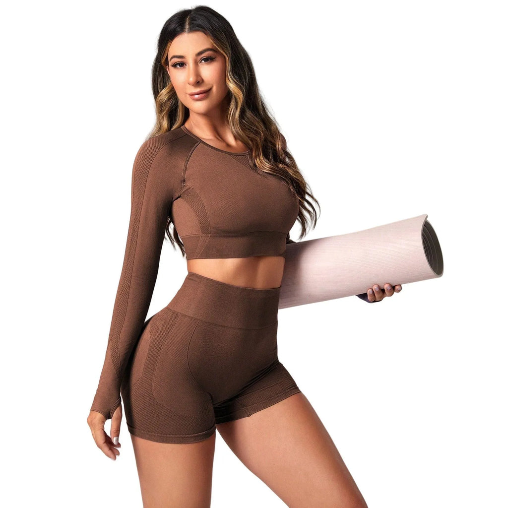 Women's black yoga suit set with high-waisted leggings and long sleeve top for fitness