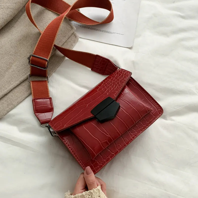 Vintage style crossbody bag in PU leather, shown in black, dimensions 20cm by 14cm.
