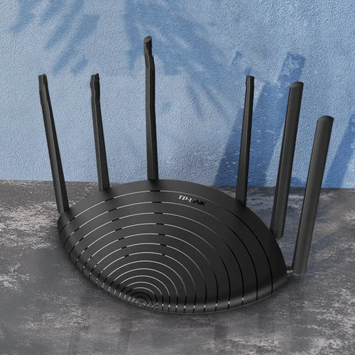 TL-WDR7661 AC1900 Gigabit wireless router with non-detachable antennas on a desk
