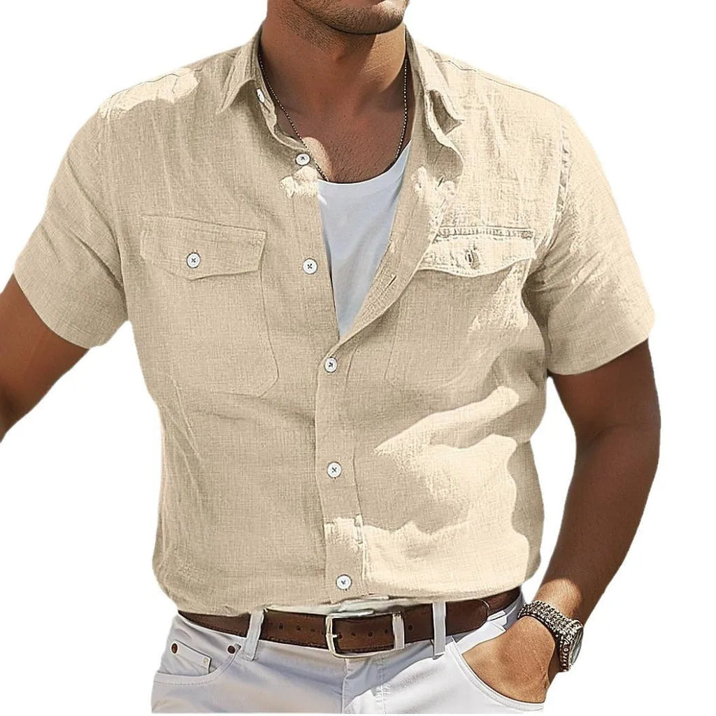 Men's loose grey linen shirt with polo collar and long sleeves on a hanger.