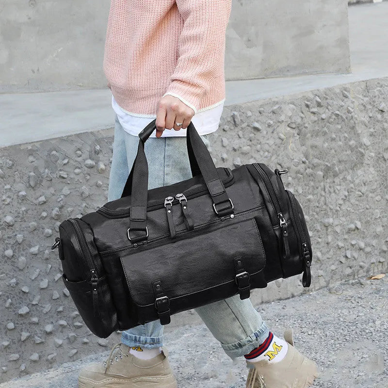 Large black travel bag with a separate shoe compartment, dimensions 52cm by 19cm by 27cm.