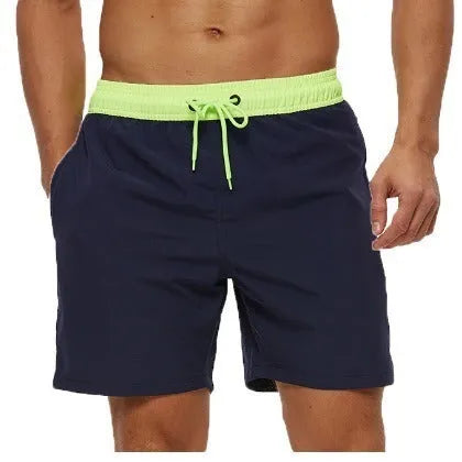 Men's blue drawstring shorts with a zippered pocket and stitching waist detail