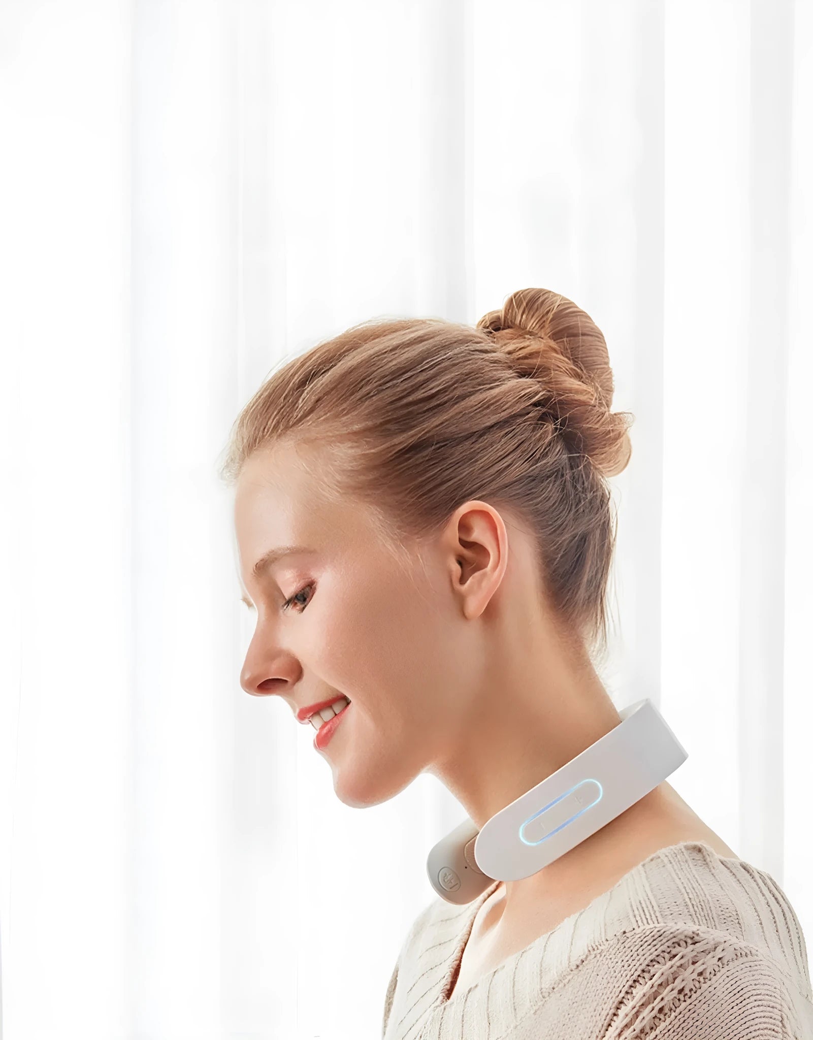 White electric acupressure massager with heat therapy for neck and shoulder pain relief.