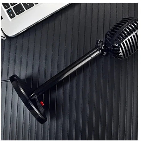 Black USB condenser microphone with adjustable gooseneck and tripod stand on a desk