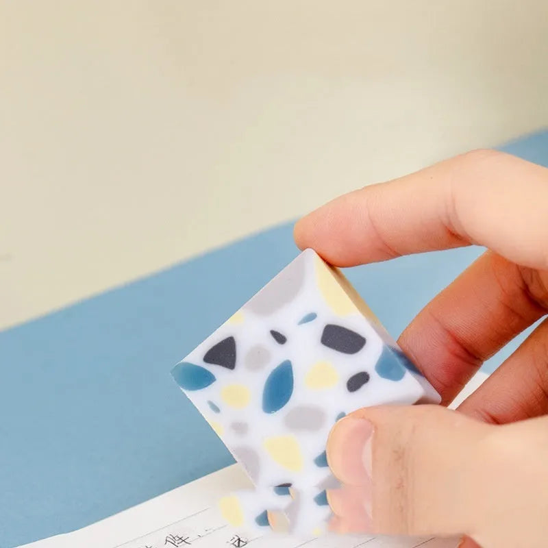 White brick-shaped rubber eraser for pencil marks with Super Clean Traceless branding