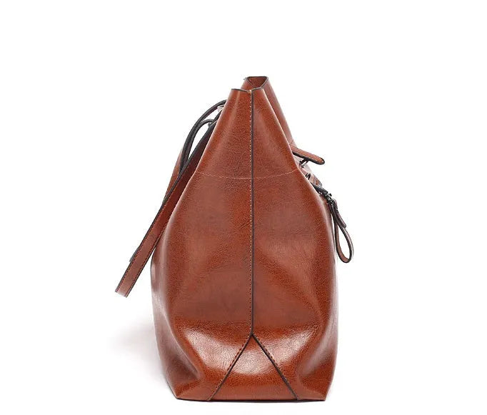 Casual wax cowhide leather ladies crossbody handbag shown in a choice of colours including black, brown, and rose red.