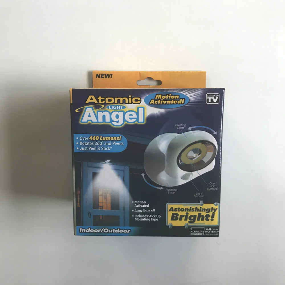 White Atomic Angel induction-powered night light with compact ABS plastic body.