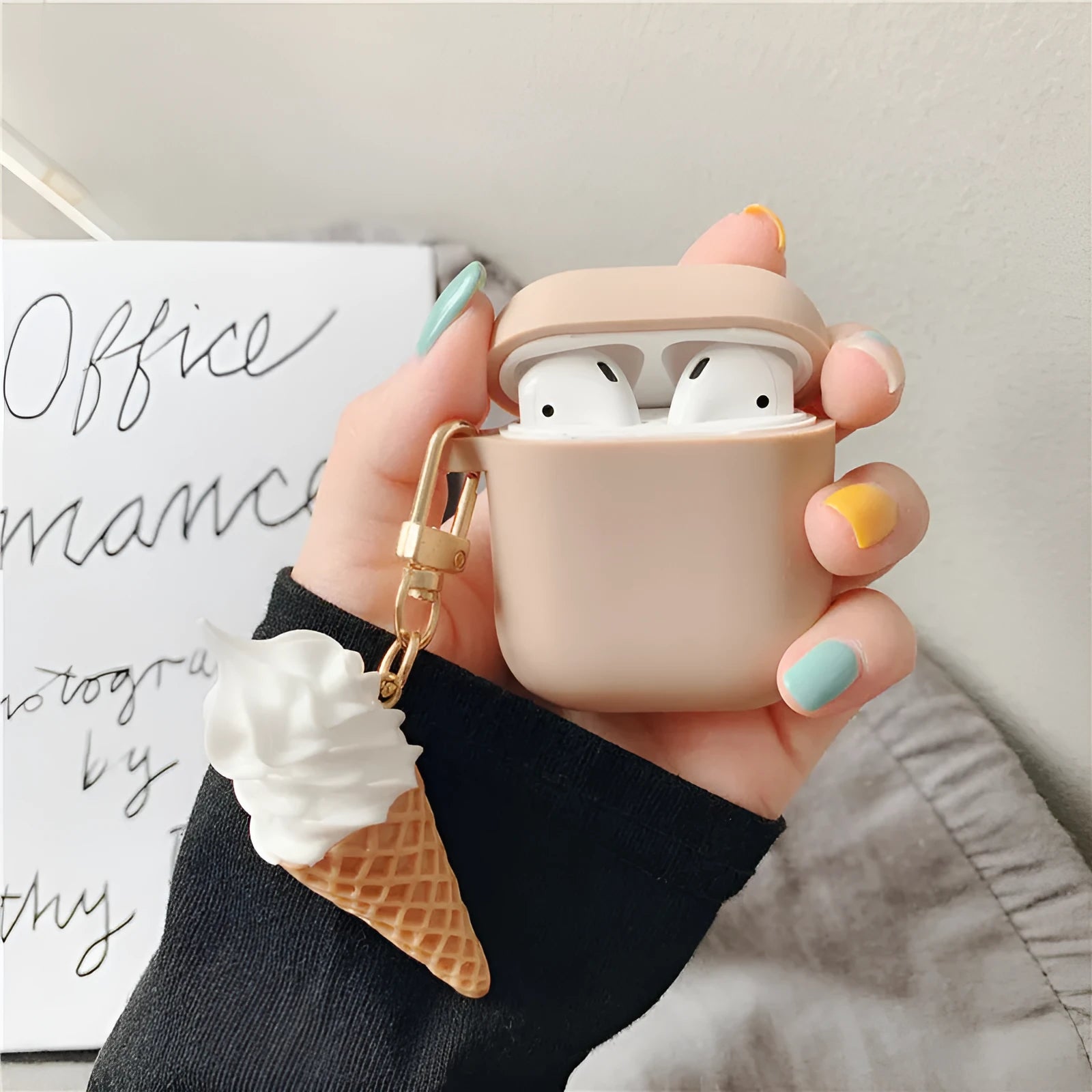 Colourful silicone protector case for Apple AirPods 2 with an ice cream cylinder swirl design.