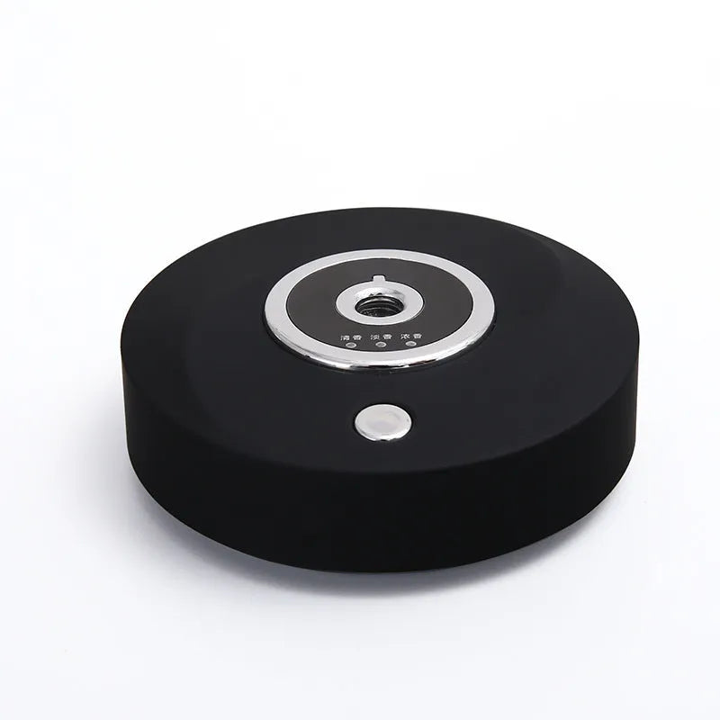 USB-powered vehicle mounted aromatherapy machine in black plastic with anti-slip pad