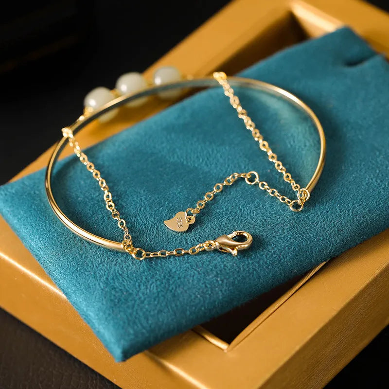 Jade lucky bead bracelet for women with gold inlay treatment in single, double and three beads versions