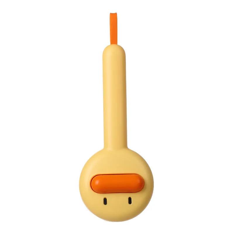 Small yellow duck-shaped pet grooming comb with needle pins for cats and small dogs