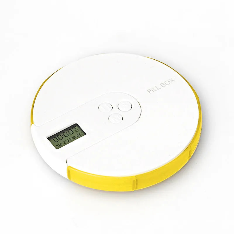 Seven-compartment alarm clock pill dispenser showing medication storage and electronic display