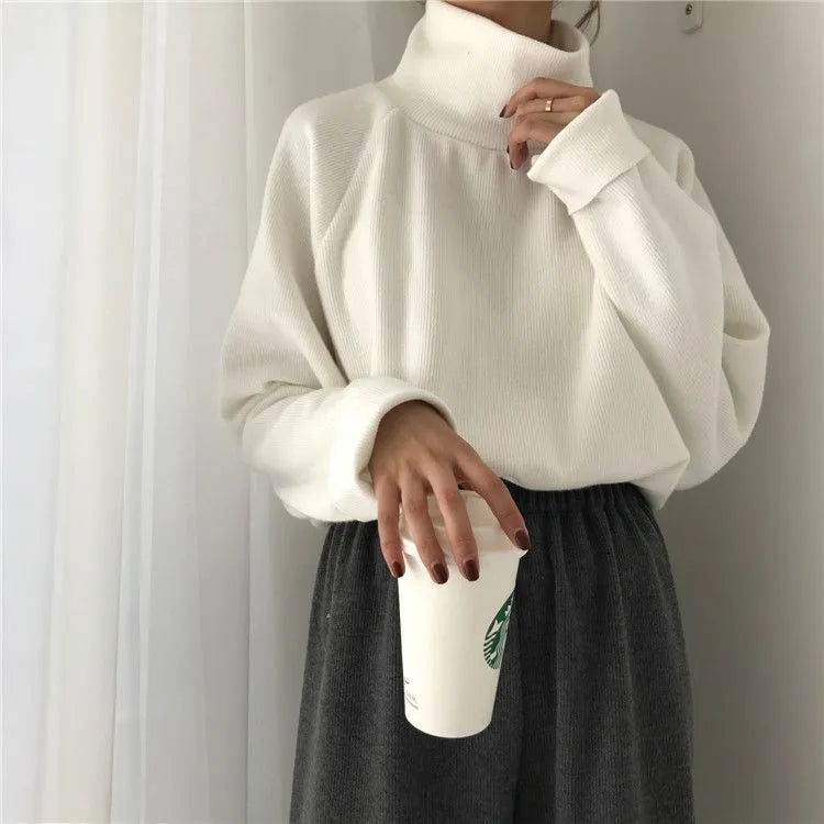 Women's plain colour loose fit long sleeve top with half-high collar in apricot, white, or black