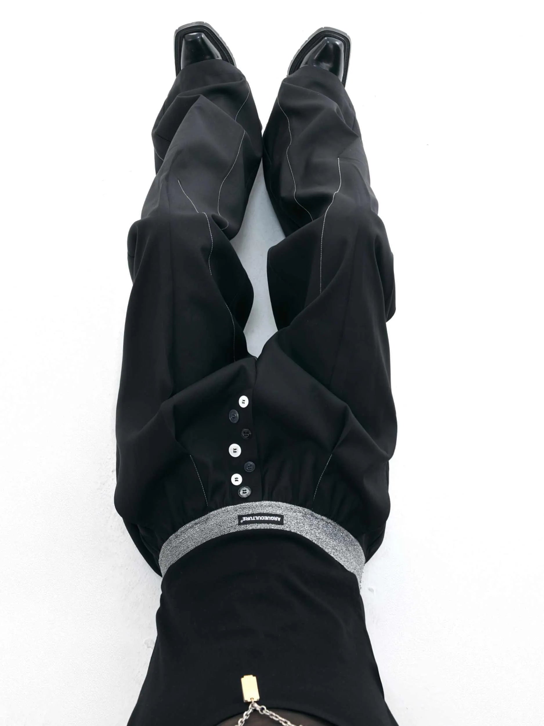 Straight-leg high-waist trousers with button open line detailing in black and grey colours