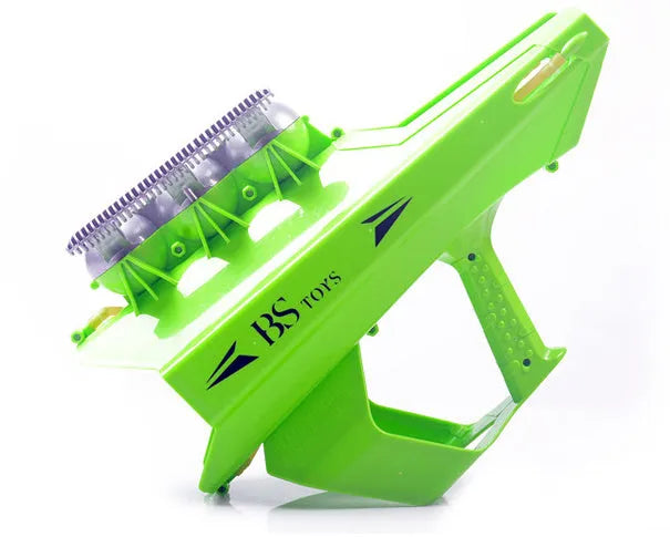 Plastic snowball clip launcher tool in black, green, and orange colours with strong rubber band
